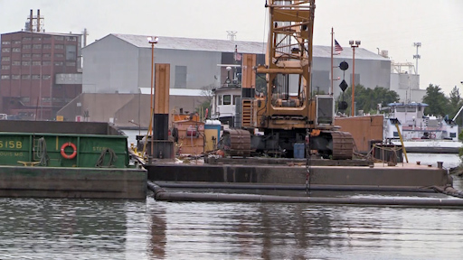 Timelapse video showing the bridge operation and barge headed to the Confined Disposal Facility (CDF)